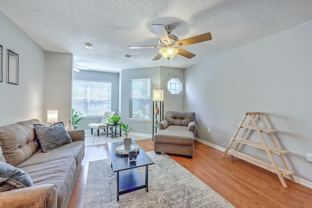 188 Midland Pkwy Unit 516, Summerville, SC 29485 - living room featuring ceiling fan, a textured ceiling, wood finished floors, and baseboards