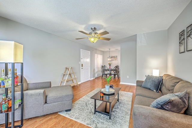 188 Midland Pkwy Unit 516, Summerville, SC 29485 - living room with wood finished floors, a ceiling fan, a textured ceiling, and baseboards