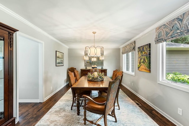 dining room with baseboards, crown molding, and dark wood-style floors