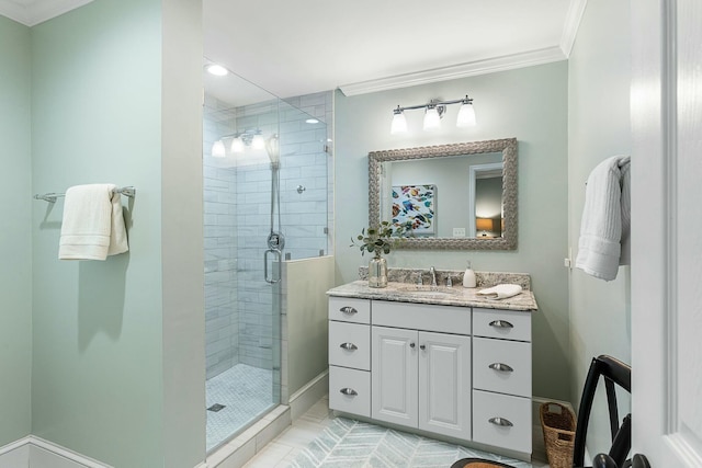 full bath featuring vanity, a shower stall, and ornamental molding