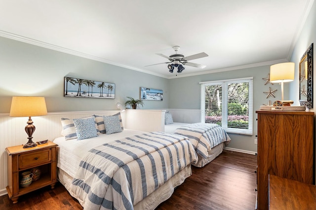 bedroom with wainscoting, a ceiling fan, ornamental molding, and dark wood-style floors
