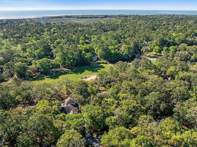 aerial view featuring a forest view and a water view