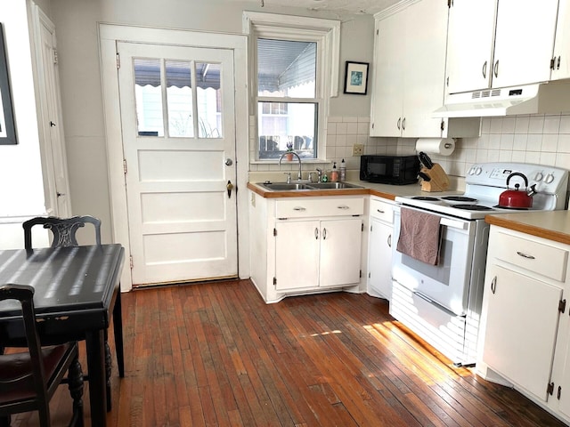 kitchen featuring white cabinetry, electric stove, and sink