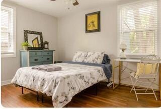 bedroom featuring ceiling fan and wood-type flooring