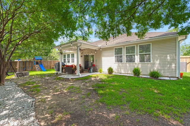 7030 Billberry St, Hanahan, SC 29410 - rear view of property featuring an outdoor hangout area, a ceiling fan, a playground, a fenced backyard, and a patio area