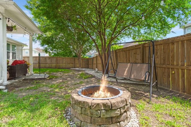 7030 Billberry St, Hanahan, SC 29410 - fenced backyard with an outdoor fire pit