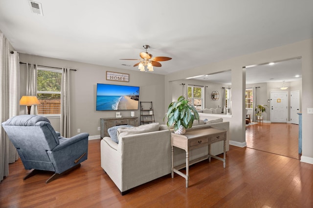 7030 Billberry St, Hanahan, SC 29410 - living area with a ceiling fan, wood finished floors, and plenty of natural light