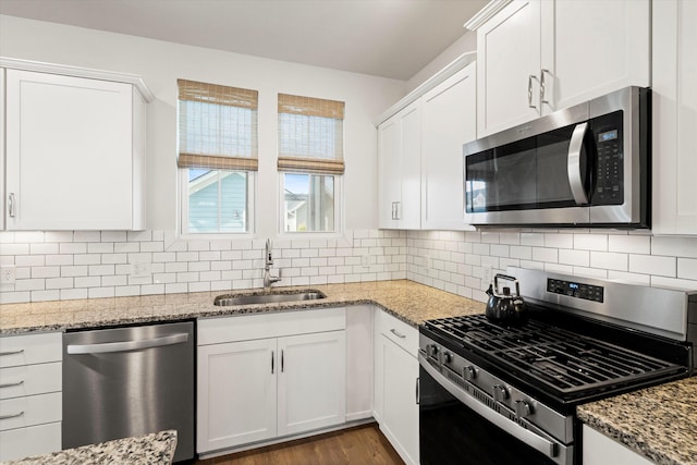 557 Blueway Ave, Summerville, SC 29486 - kitchen featuring appliances with stainless steel finishes, a sink, white cabinets, and tasteful backsplash