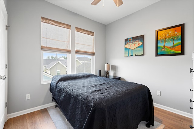 557 Blueway Ave, Summerville, SC 29486 - bedroom with wood finished floors, baseboards, and a ceiling fan
