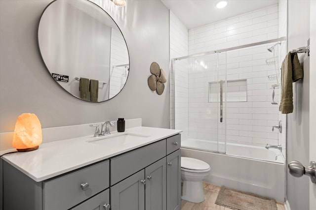 557 Blueway Ave, Summerville, SC 29486 - full bathroom featuring vanity, toilet, shower / bath combination with glass door, wood finished floors, and recessed lighting