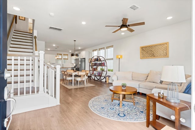 557 Blueway Ave, Summerville, SC 29486 - living area featuring light wood-style floors, recessed lighting, stairway, and ceiling fan