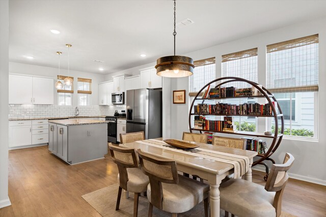 557 Blueway Ave, Summerville, SC 29486 - dining room featuring light wood-type flooring, recessed lighting, and baseboards
