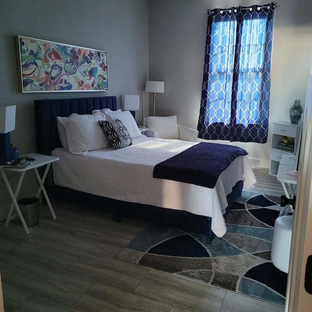 bedroom with wood finished floors