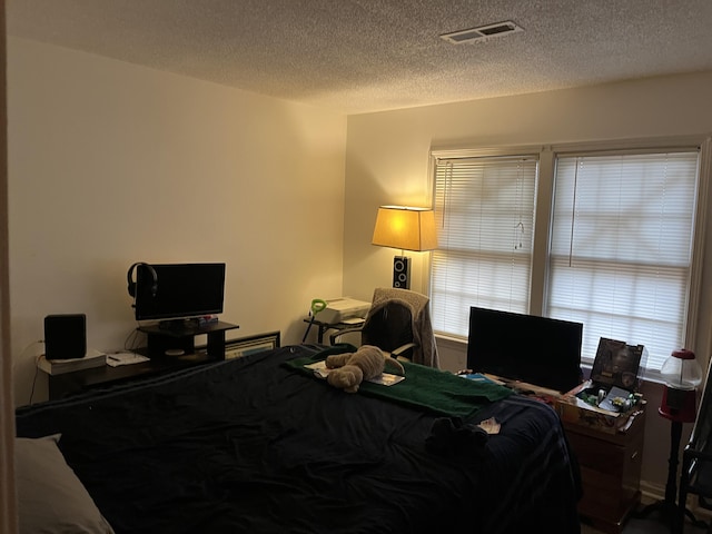 bedroom with a textured ceiling