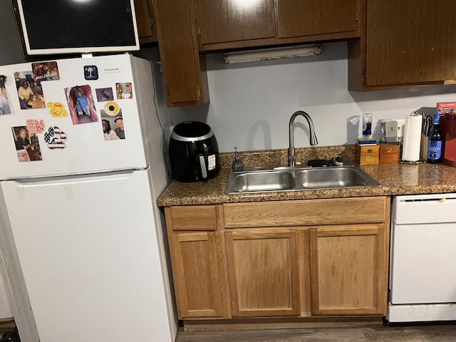 kitchen with white appliances and sink