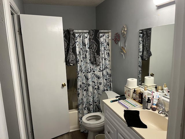 full bathroom with vanity, shower / bath combination with curtain, and toilet