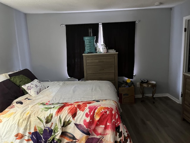 bedroom featuring dark hardwood / wood-style floors