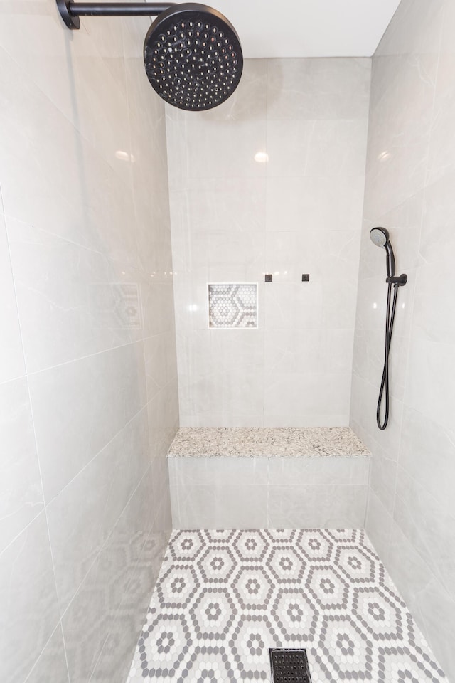 bathroom with tiled shower