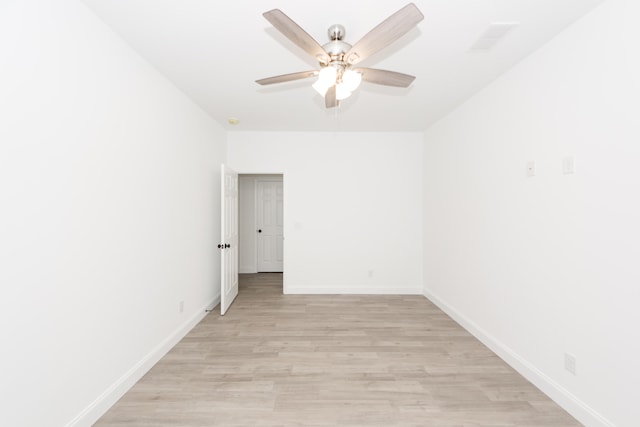 unfurnished room with ceiling fan and light hardwood / wood-style flooring