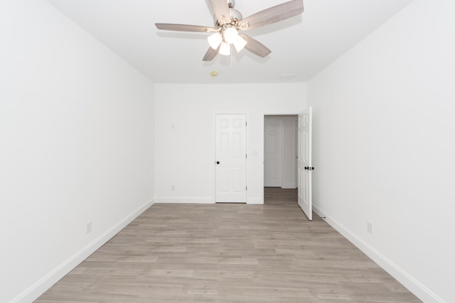 unfurnished room featuring ceiling fan and light hardwood / wood-style floors