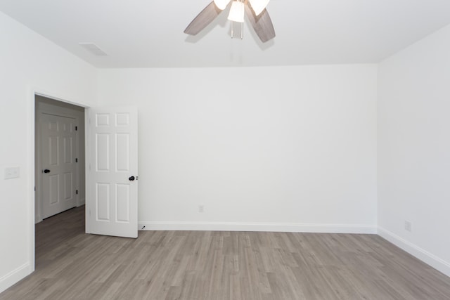 spare room with ceiling fan and light hardwood / wood-style floors