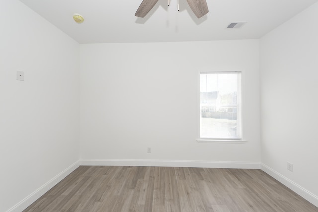 spare room with ceiling fan and light hardwood / wood-style flooring