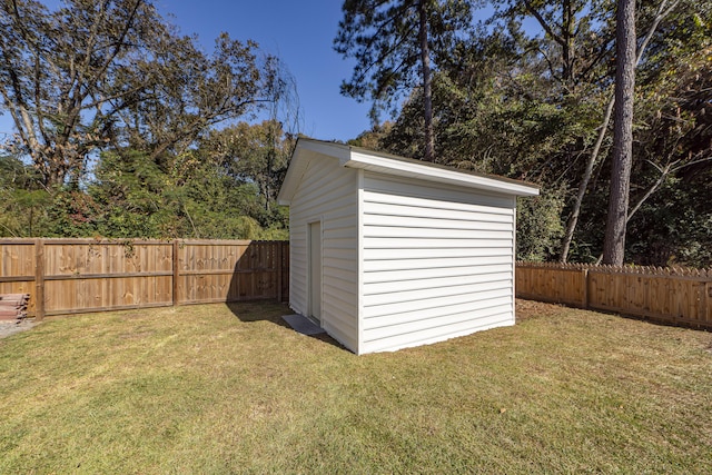 view of outdoor structure featuring a lawn