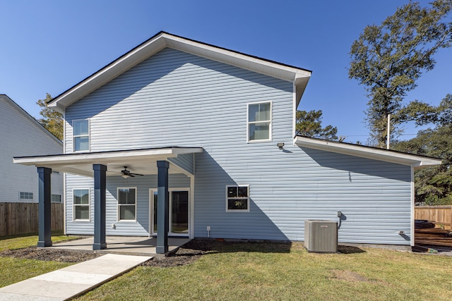 back of house featuring ceiling fan, cooling unit, a yard, and a patio