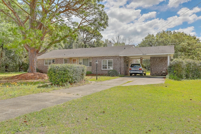 ranch-style house featuring a carport and a front yard