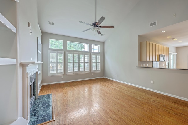 9379 Harroway Rd, Summerville, SC 29485 - unfurnished living room with light wood finished floors, baseboards, and visible vents
