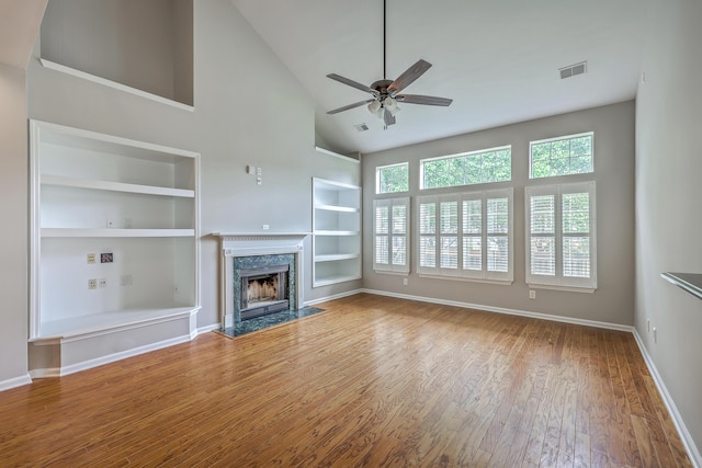 9379 Harroway Rd, Summerville, SC 29485 - unfurnished living room featuring baseboards, a ceiling fan, built in features, and wood finished floors