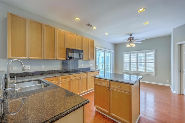 9379 Harroway Rd, Summerville, SC 29485 - kitchen with a sink, visible vents, light wood-style floors, ceiling fan, and black appliances