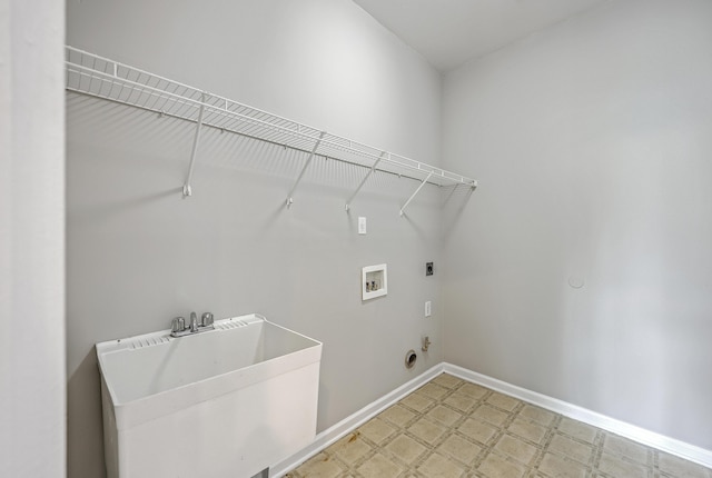 9379 Harroway Rd, Summerville, SC 29485 - laundry area with hookup for a washing machine, a sink, hookup for an electric dryer, baseboards, and laundry area