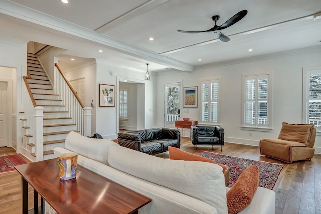 living area featuring ceiling fan, baseboards, stairway, recessed lighting, and hardwood / wood-style flooring