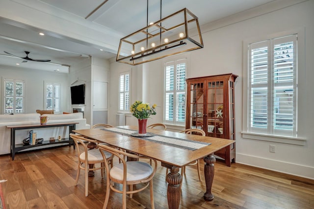 dining area with recessed lighting, a ceiling fan, baseboards, and wood finished floors