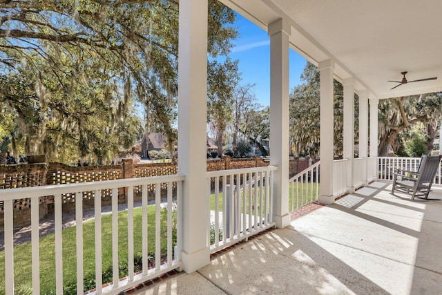 balcony featuring a porch and a ceiling fan