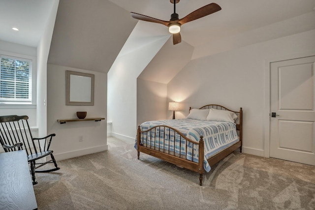 bedroom with carpet flooring, baseboards, and lofted ceiling