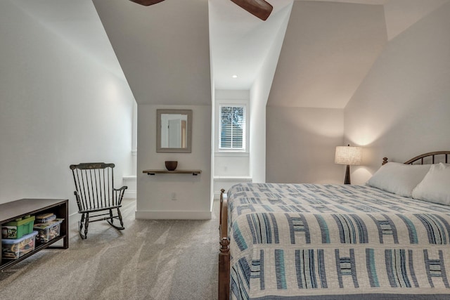 bedroom with lofted ceiling, carpet flooring, baseboards, and ceiling fan