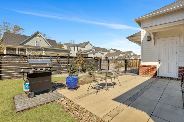 view of patio with grilling area and fence