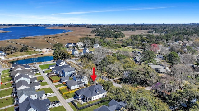 drone / aerial view featuring a residential view and a water view