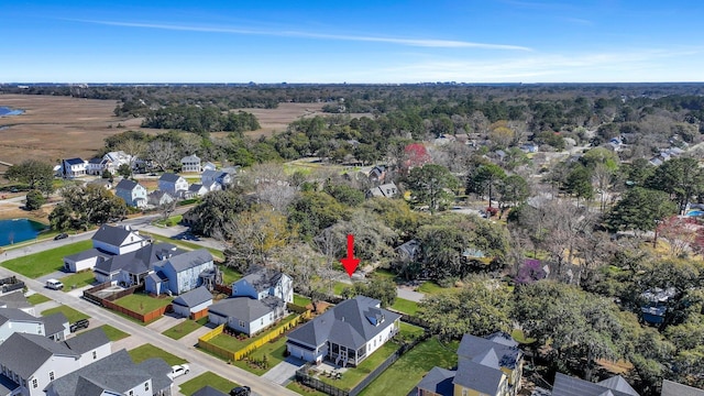 bird's eye view featuring a residential view and a water view