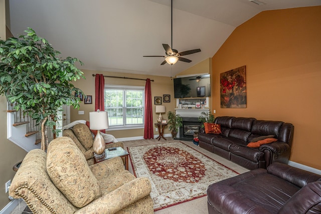 1409 Bloomingdale Ln, Mount Pleasant, SC 29466 - living room featuring lofted ceiling, ceiling fan, baseboards, a fireplace, and carpet flooring
