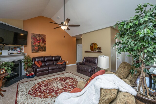 1409 Bloomingdale Ln, Mount Pleasant, SC 29466 - carpeted living area with vaulted ceiling, a ceiling fan, a fireplace with flush hearth, and baseboards
