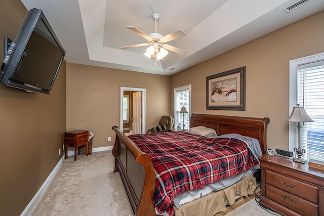 1409 Bloomingdale Ln, Mount Pleasant, SC 29466 - bedroom featuring a tray ceiling, light carpet, baseboards, and a ceiling fan