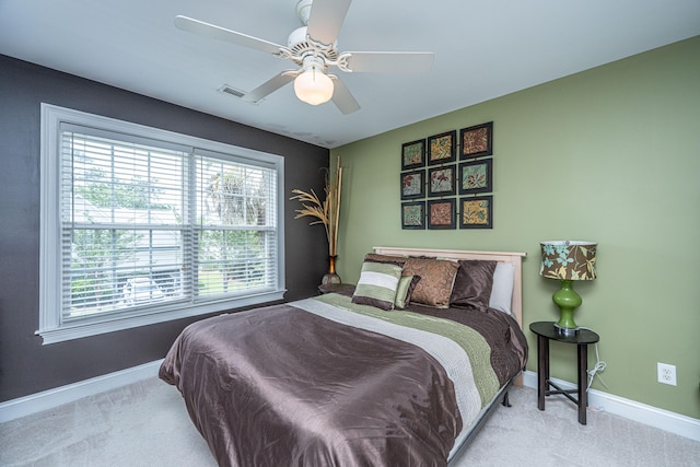1409 Bloomingdale Ln, Mount Pleasant, SC 29466 - carpeted bedroom featuring baseboards, multiple windows, and a ceiling fan