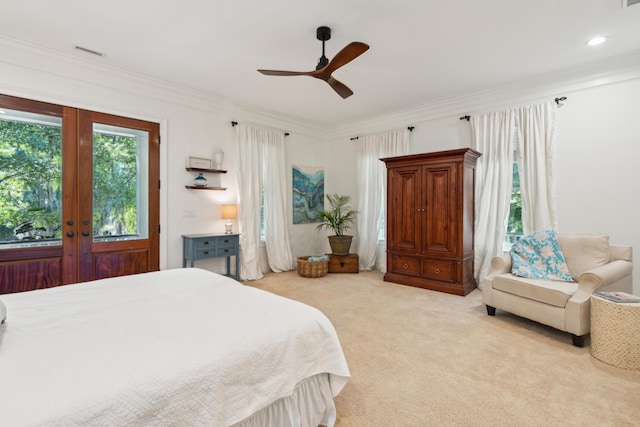 bedroom featuring french doors, ceiling fan, ornamental molding, and light carpet