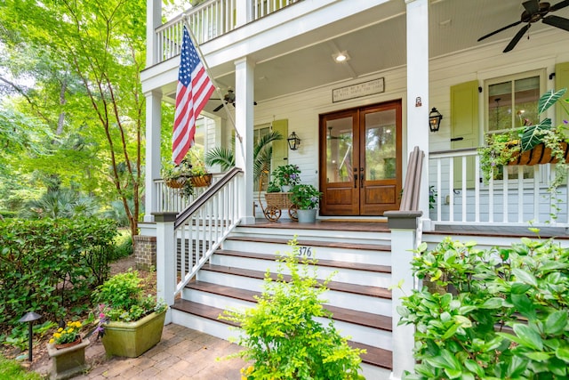 doorway to property featuring french doors, ceiling fan, and covered porch