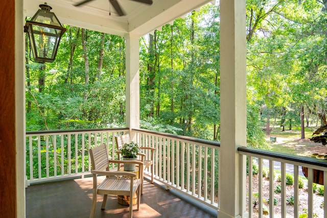 balcony with ceiling fan and a porch