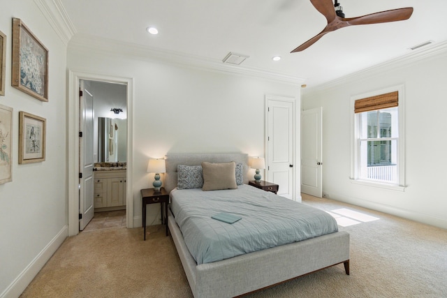 bedroom featuring light carpet, ensuite bath, ornamental molding, and ceiling fan