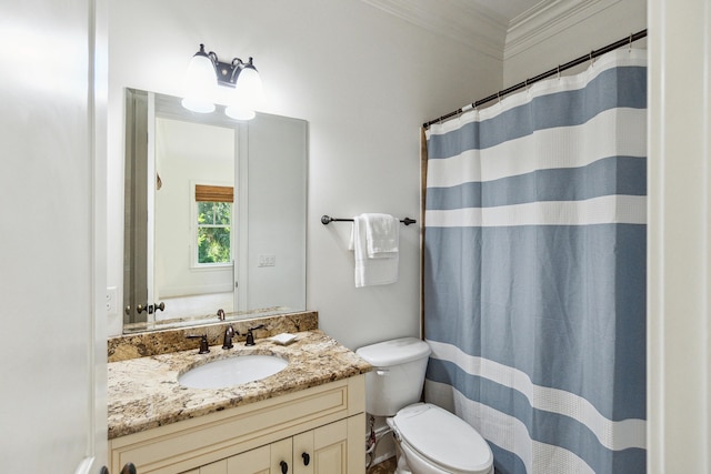 bathroom with vanity, curtained shower, ornamental molding, and toilet